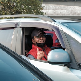 Happy customer receiving their car after glass replacement service.