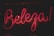 Bright pink neon sign displaying the word 'Beleza' against a dark background. The glowing letters have a cursive style, creating an eye-catching and lively appearance.