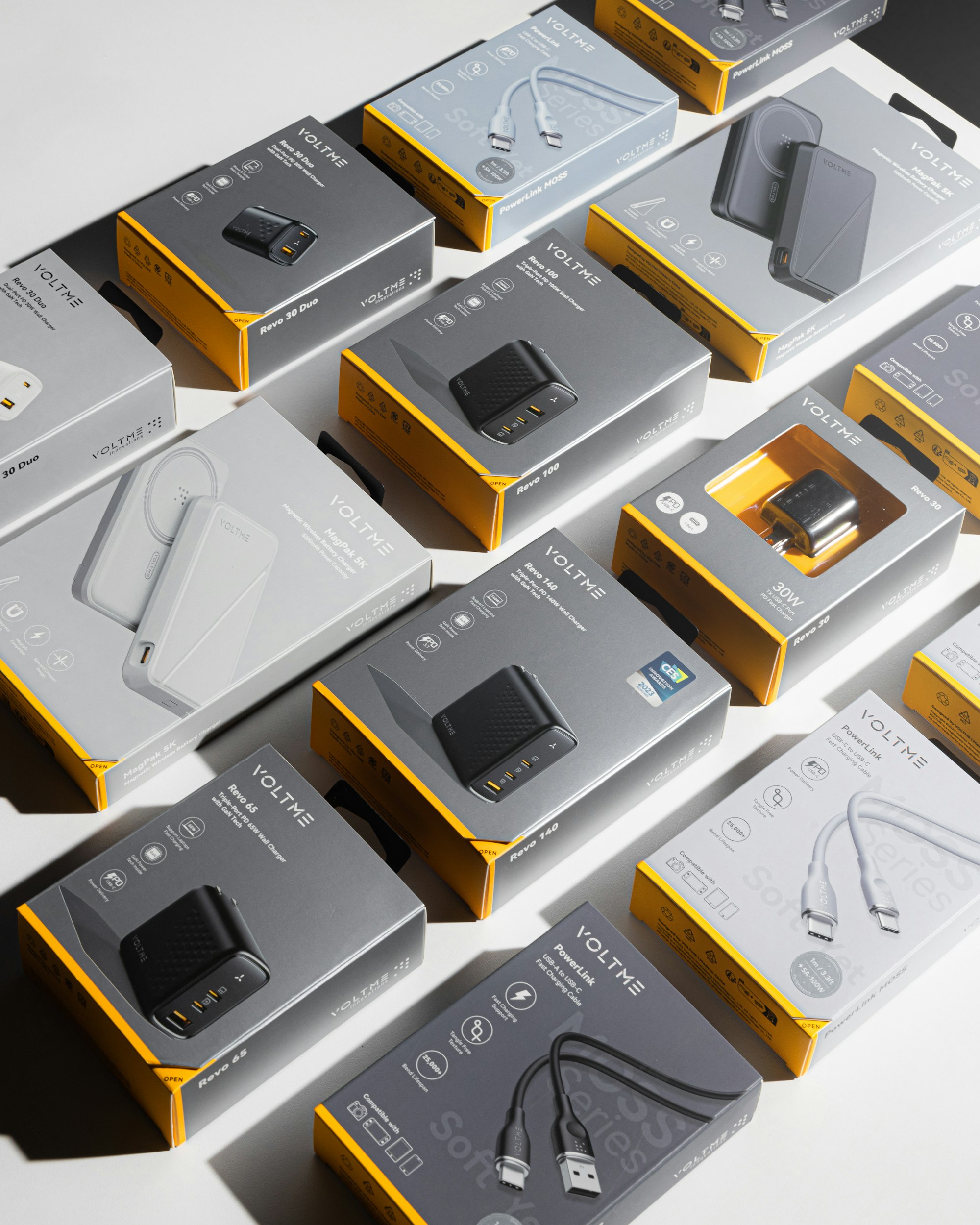 Rows of packaged phone accessories, chargers and cables on retail shelving