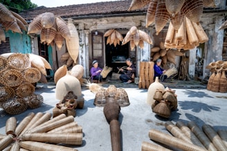 a group of people sitting in front of a building