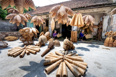a group of wooden objects sitting on top of a cement ground