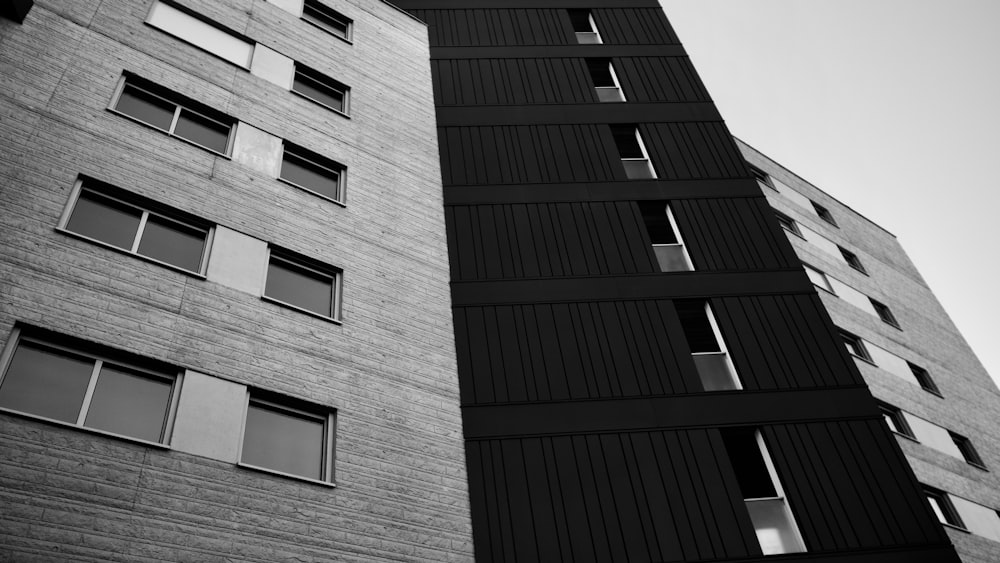 a black and white photo of two tall buildings