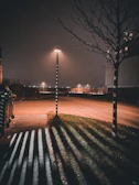 Wide shot of a quiet urban street at dusk, captured with moody, cinematic lighting and deep contrasts.