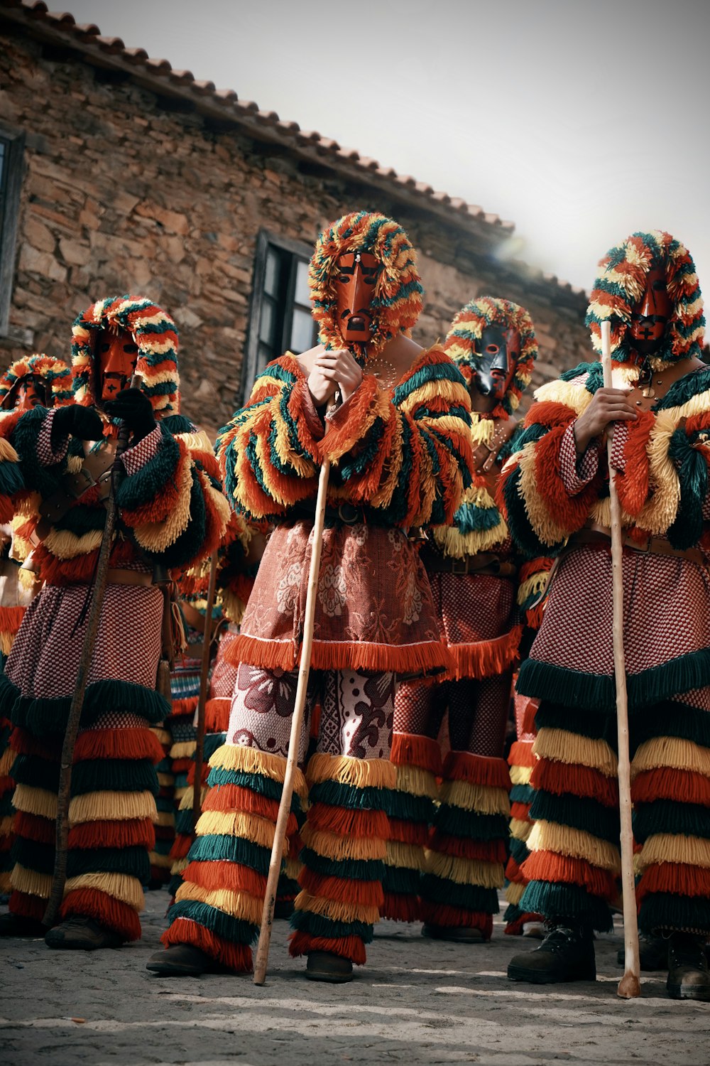 a group of people dressed in colorful costumes