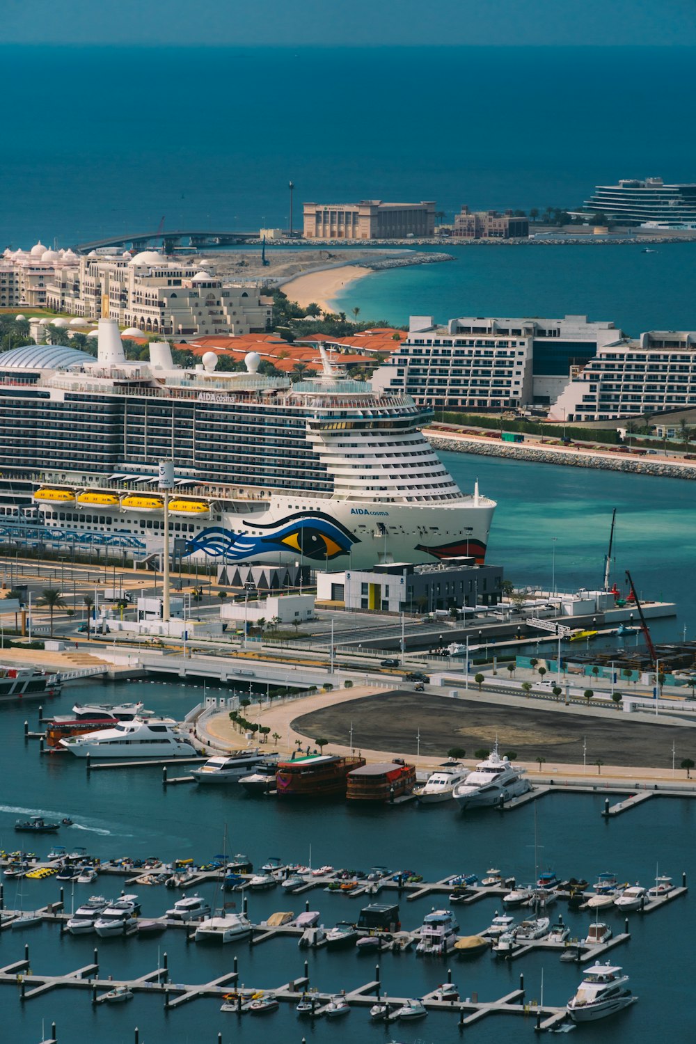 a large cruise ship docked in a harbor