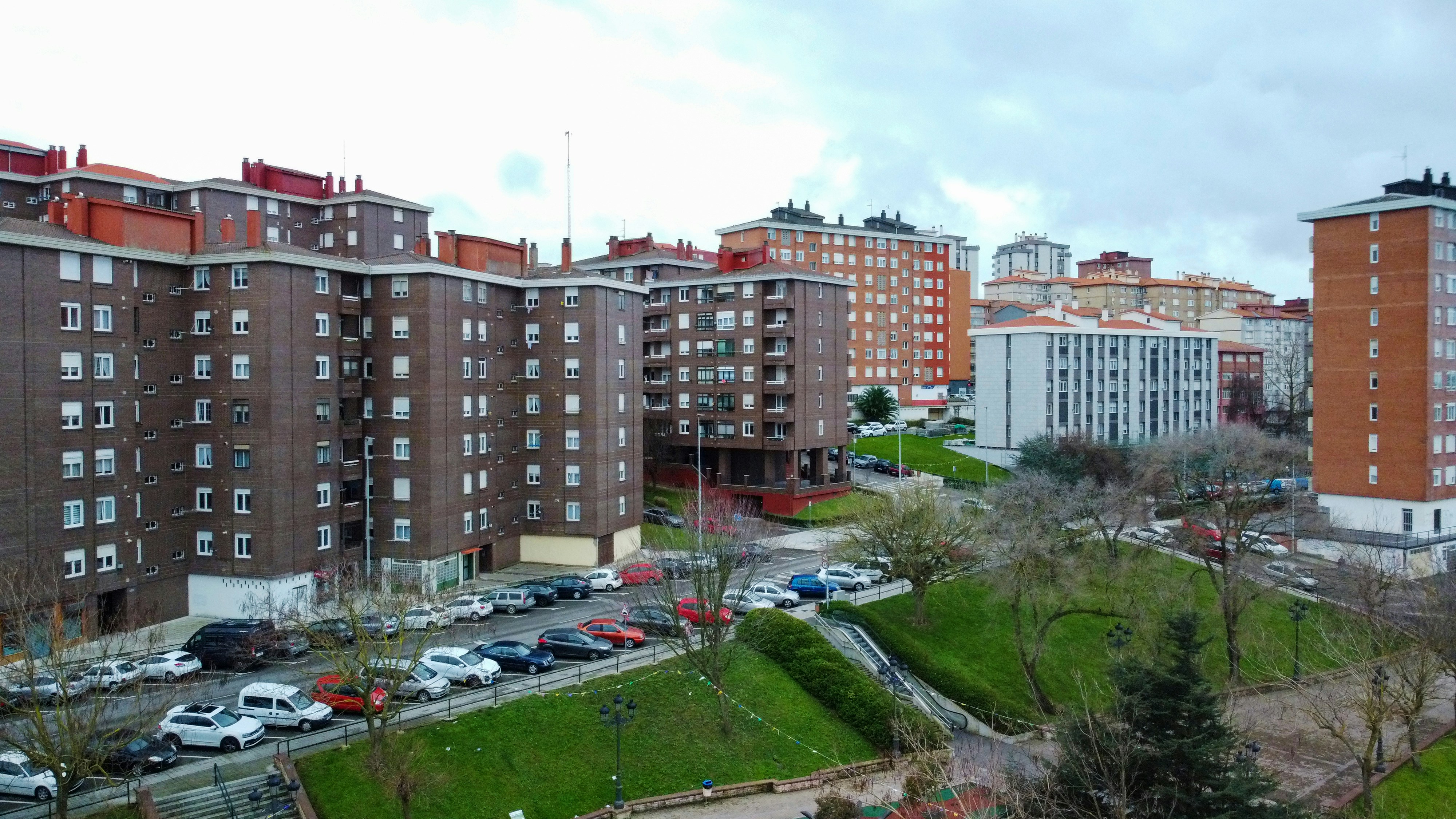 a view of a parking lot with cars parked in it
