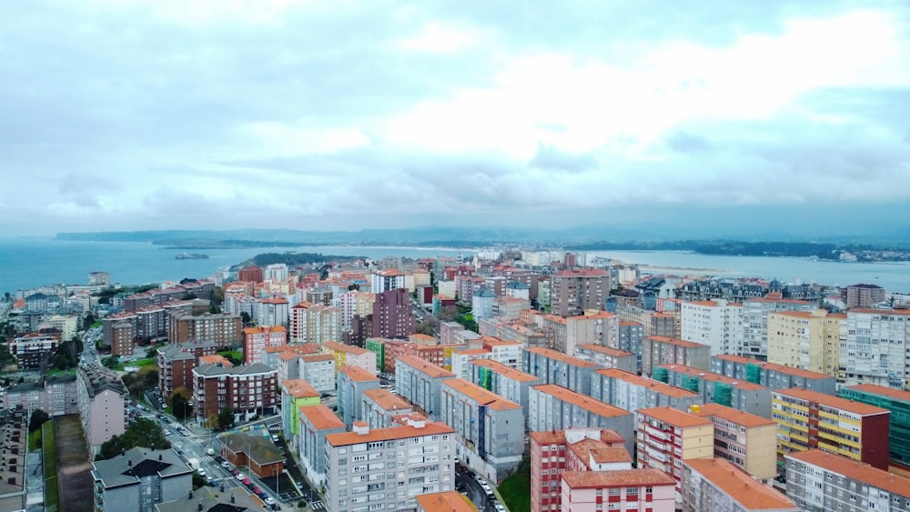 a view of a city with a body of water in the background