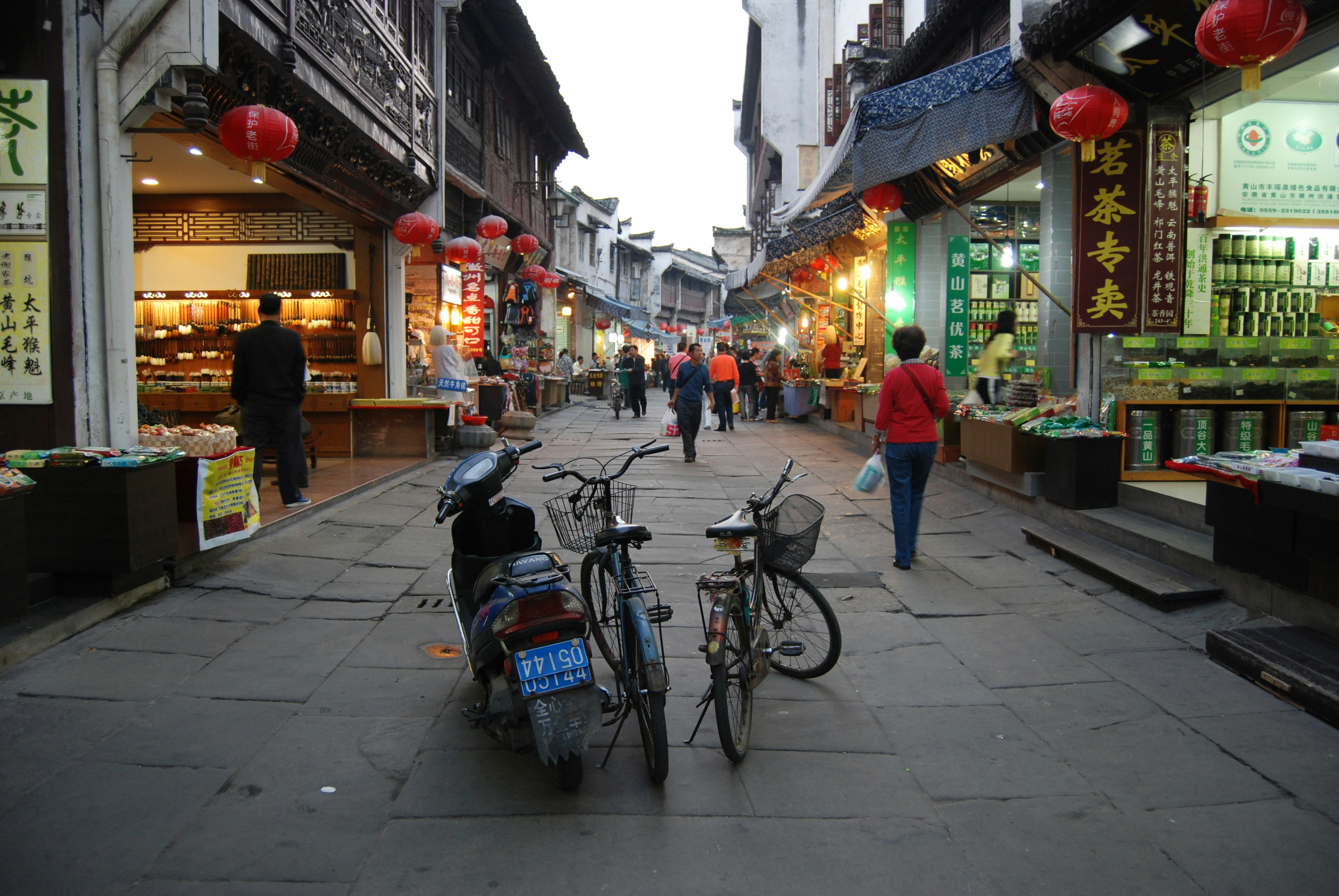 a couple of bikes parked on the side of a street