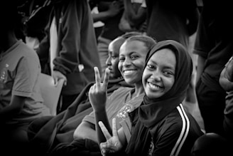 a group of women sitting next to each other