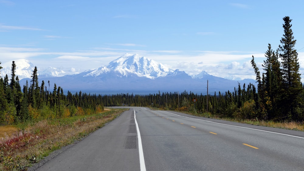 a road with a mountain in the background