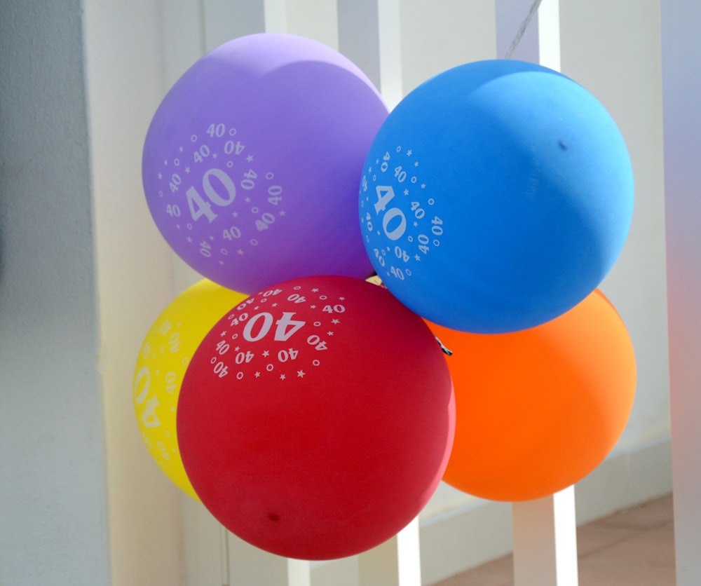 a bunch of balloons with the number forty on them