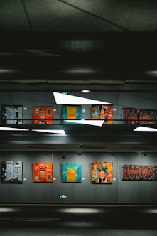 a group of paintings hanging on a wall
