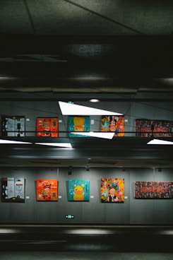 a group of paintings hanging on a wall