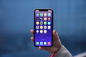 a person holding an iphone in their hand