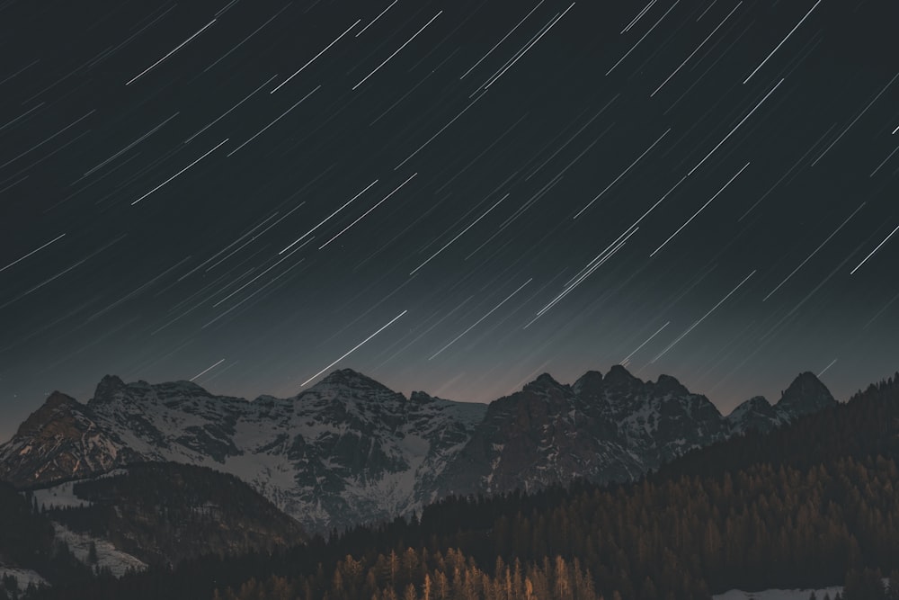 a mountain range with stars in the sky