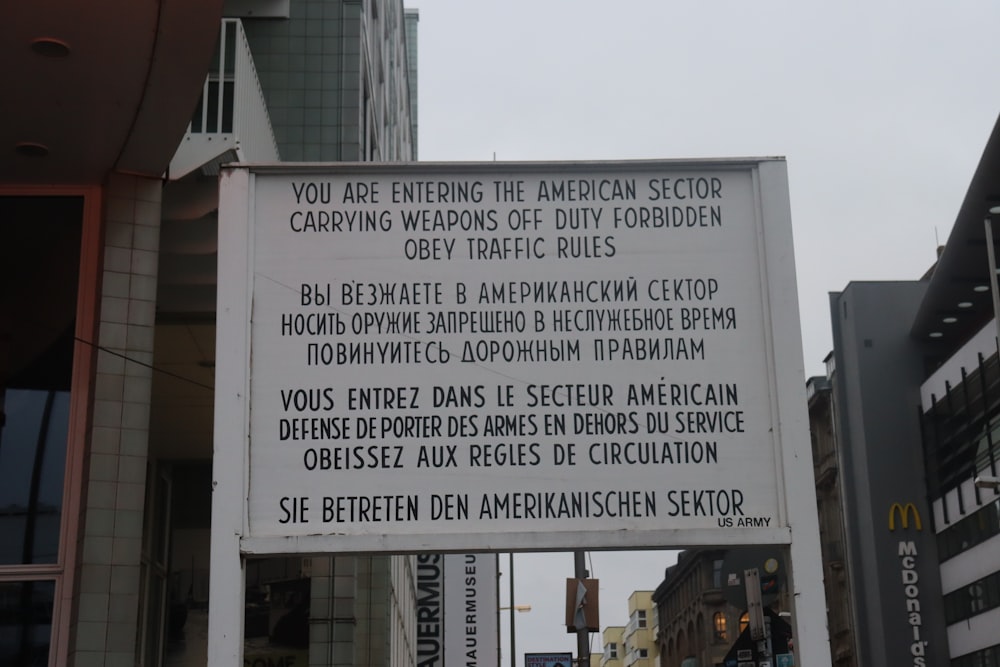 a sign on the side of a building that says you are entering the american sector