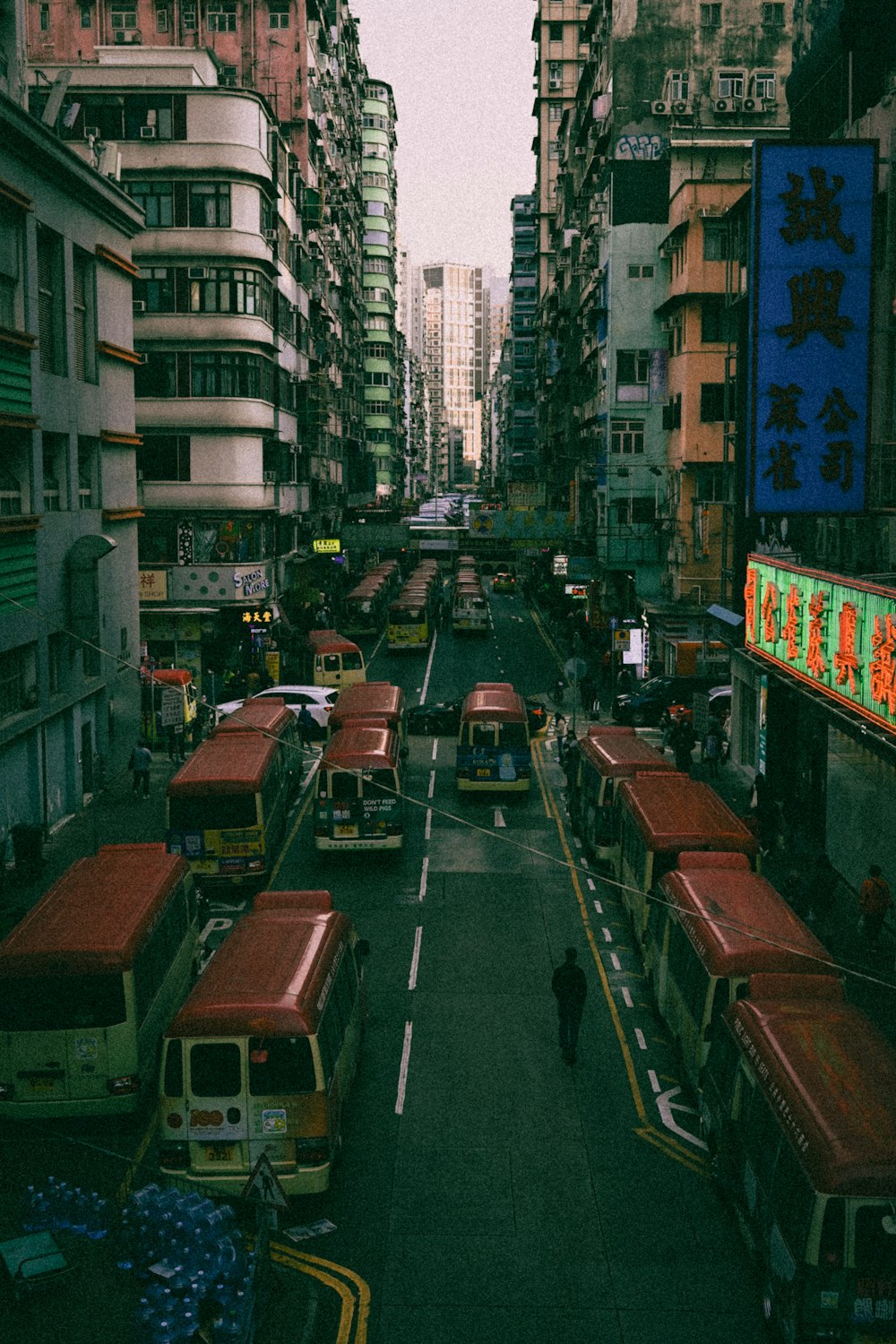 a city street filled with lots of buses
