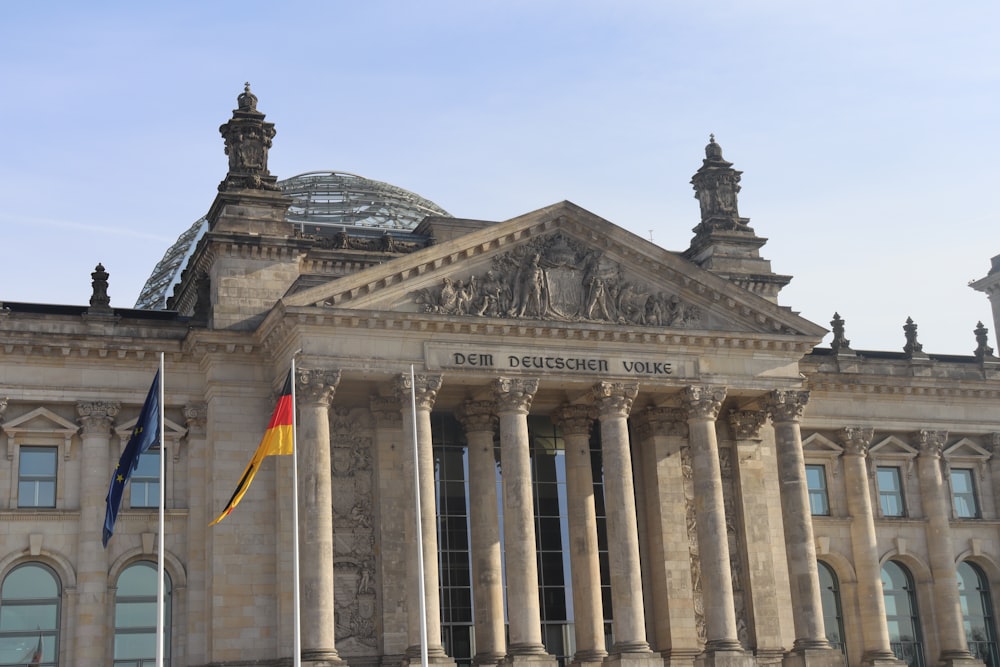 a large building with columns and a dome on top