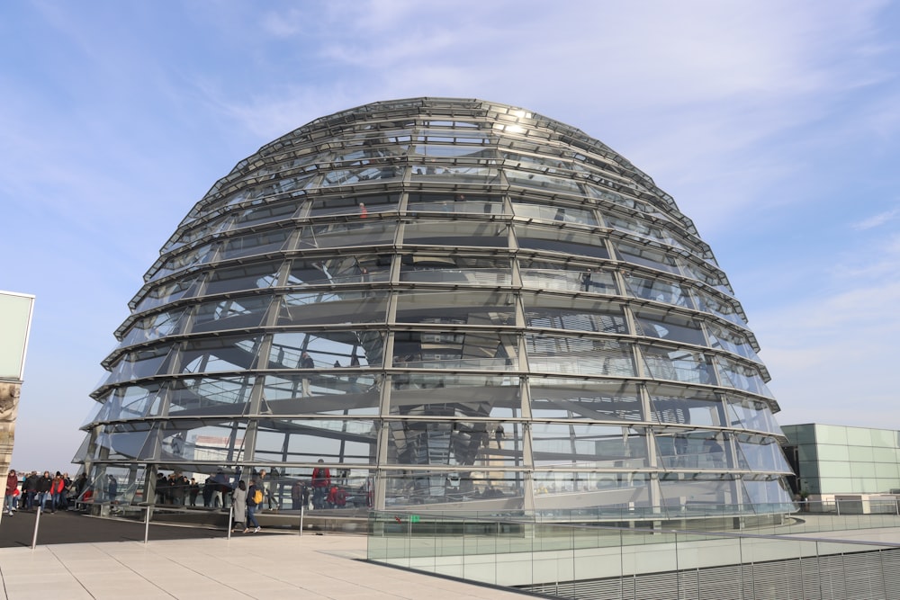 a very large glass dome with a sky background