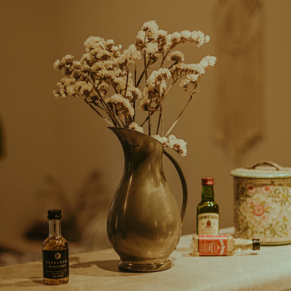 a vase filled with flowers sitting on top of a table