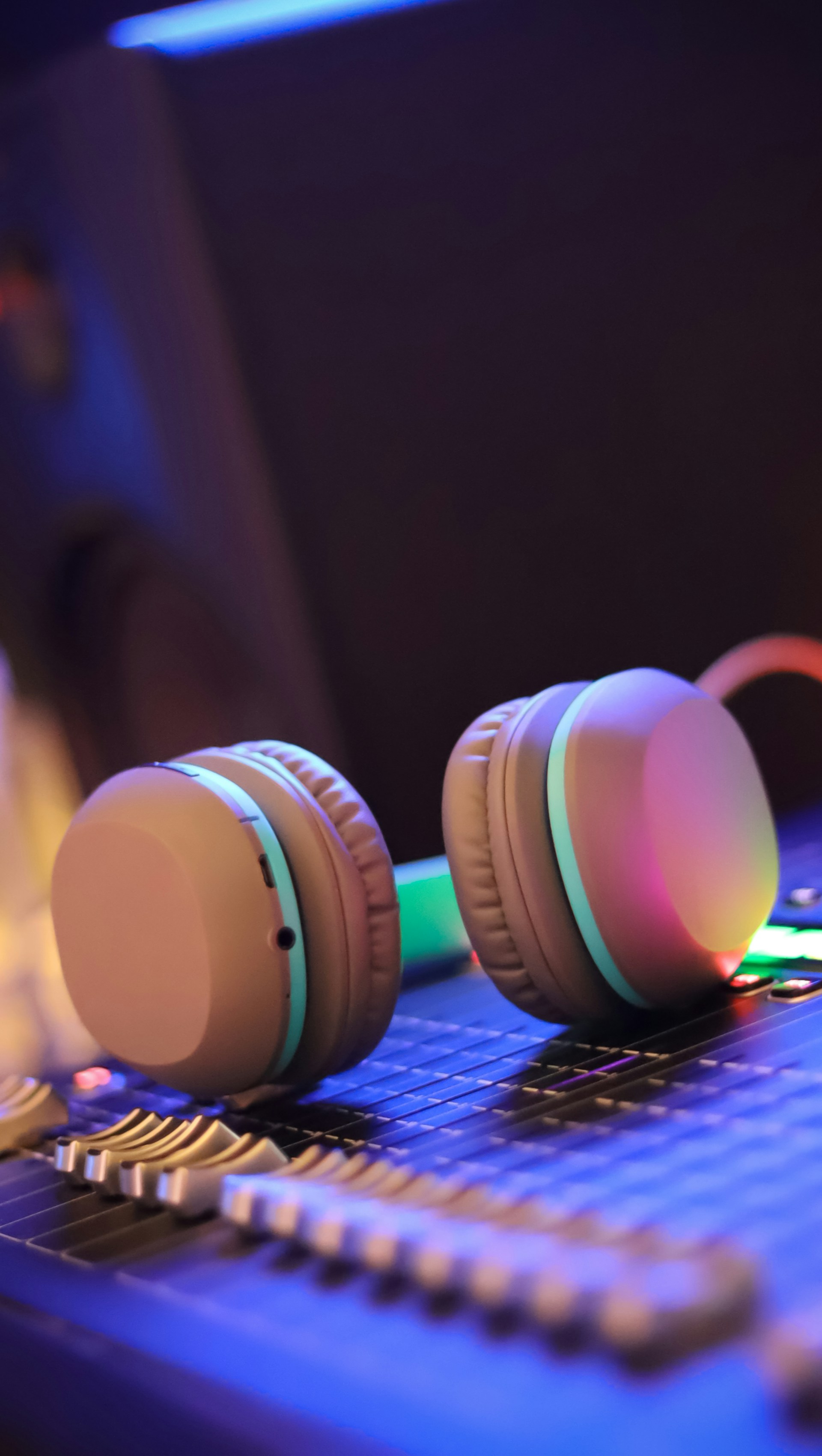 a pair of headphones sitting on top of a laptop