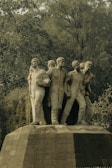 a statue of a group of men standing next to each other