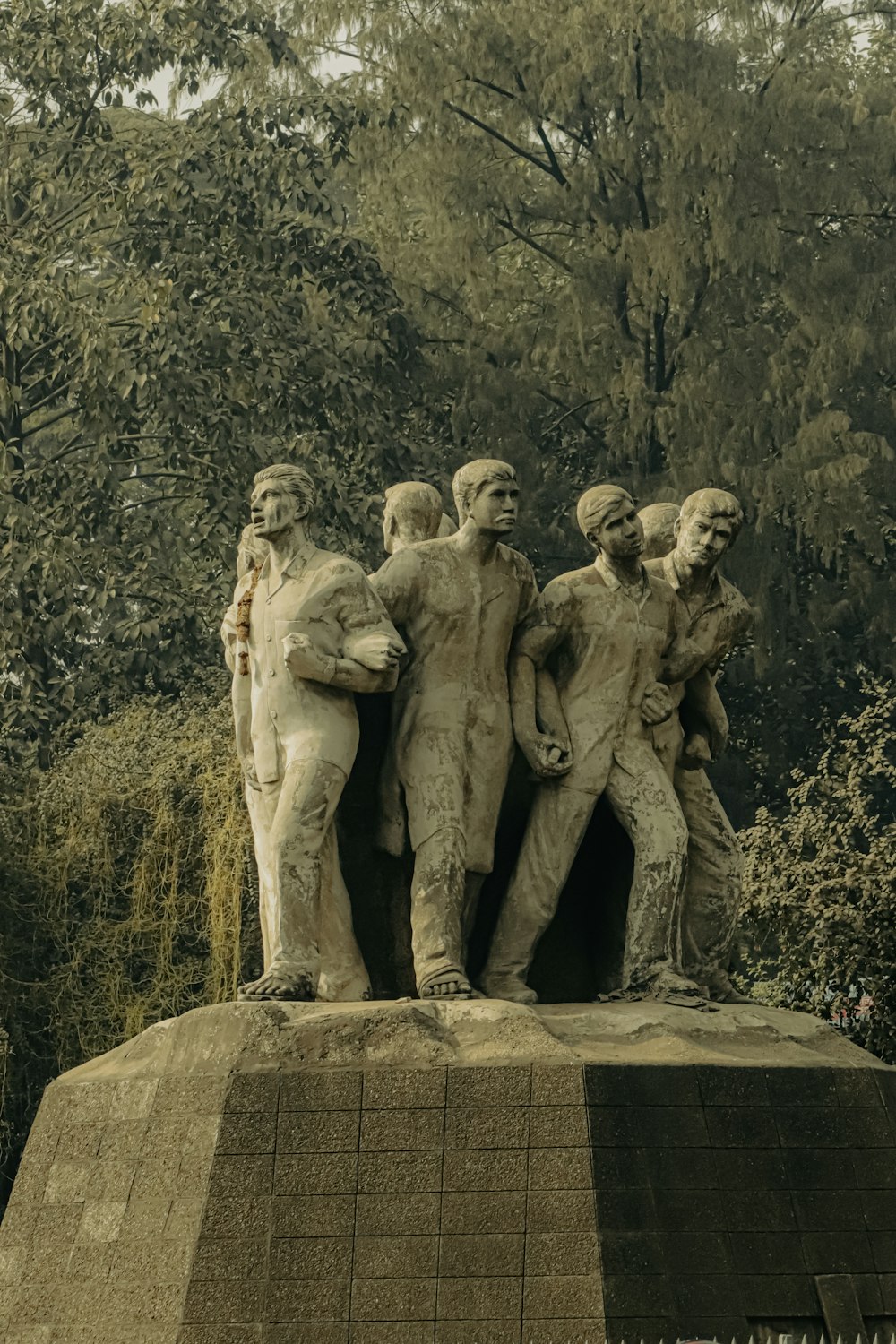 a statue of a group of men standing next to each other