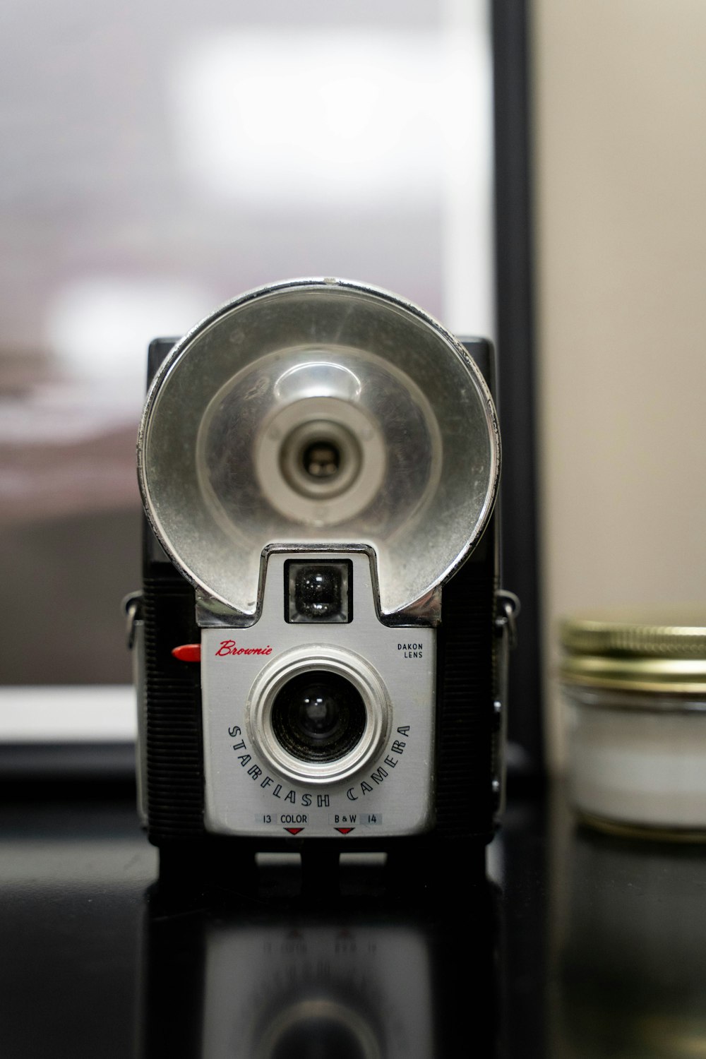 an old camera sitting on top of a table