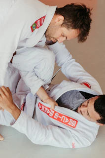 a couple of men standing next to each other in a room