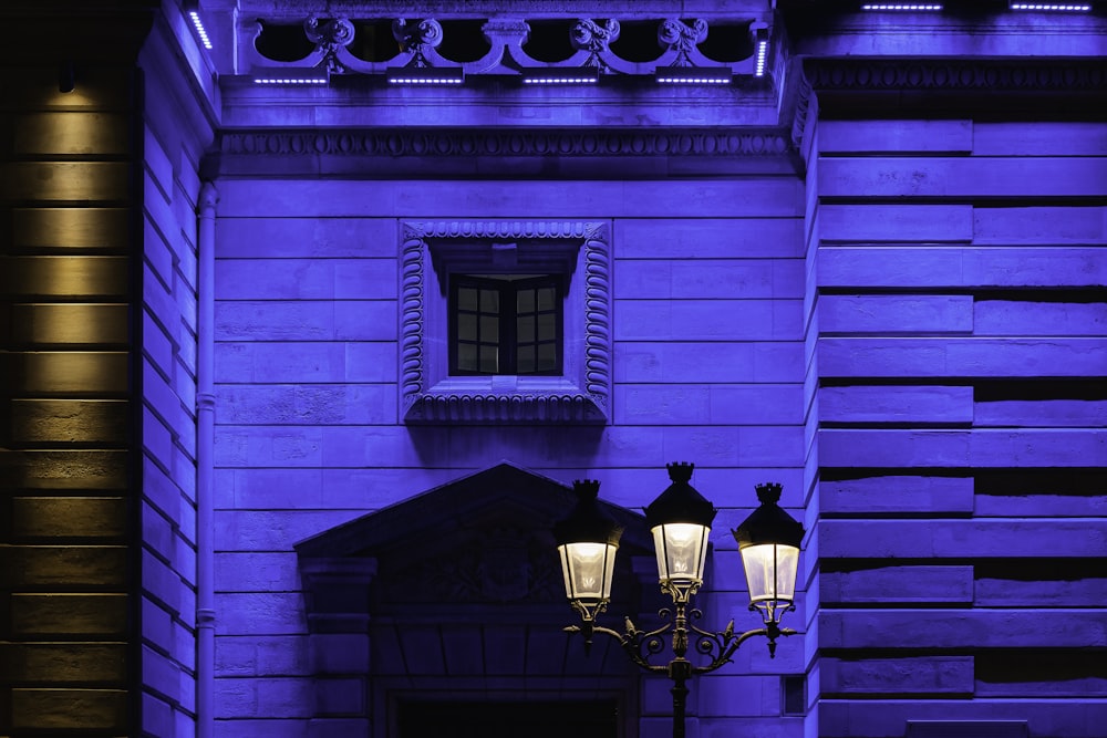 a building with a blue light on the side of it