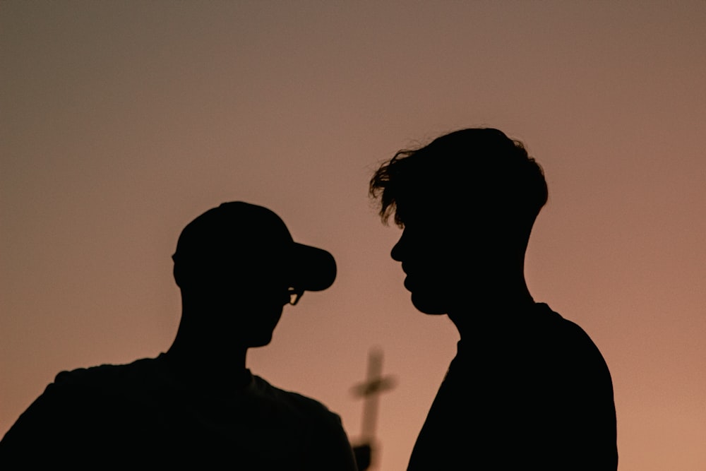 a couple of men standing next to each other