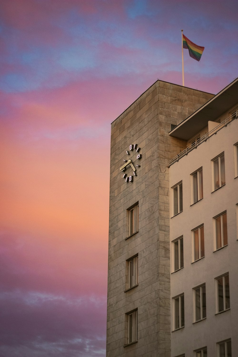 a tall building with a clock on the side of it