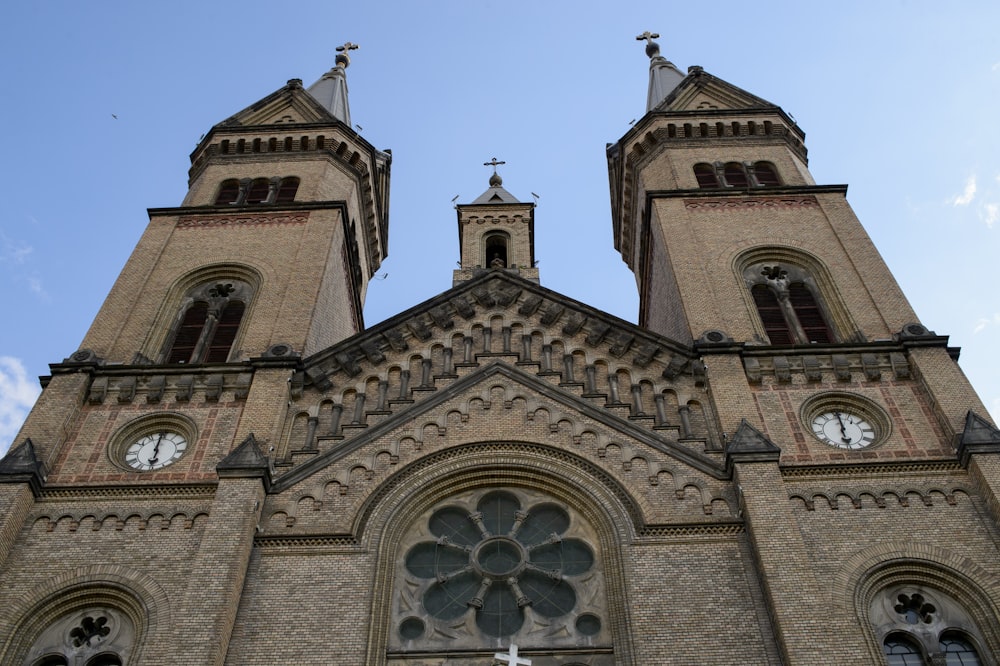 a tall church with two clocks on each of it's sides