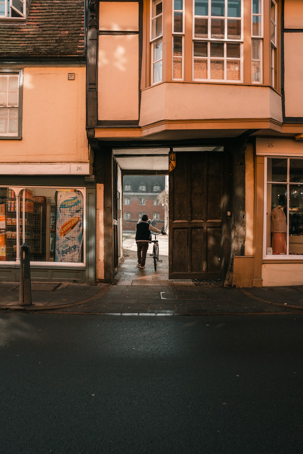 a person walking out of a doorway into a building