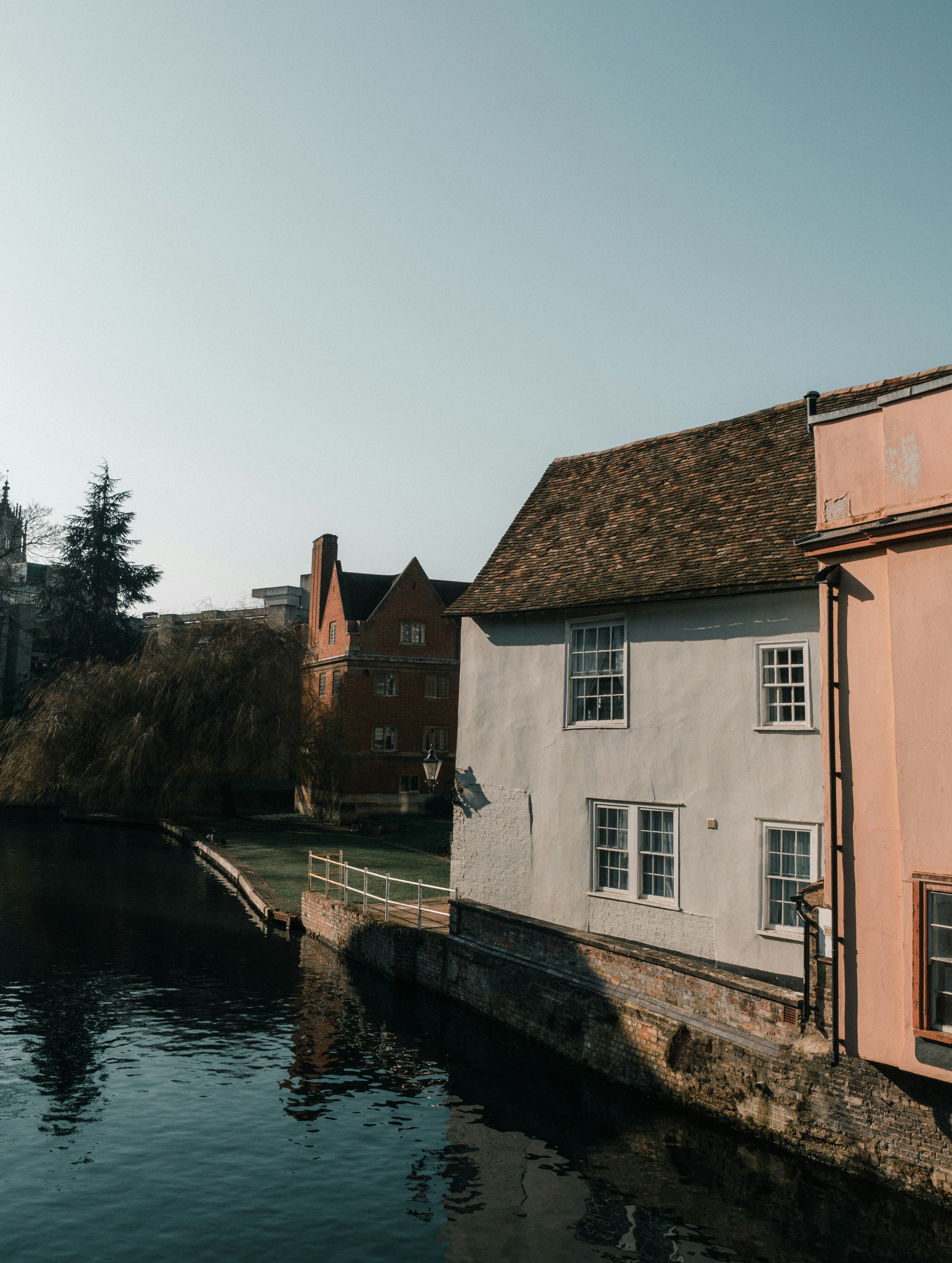 a house next to a body of water