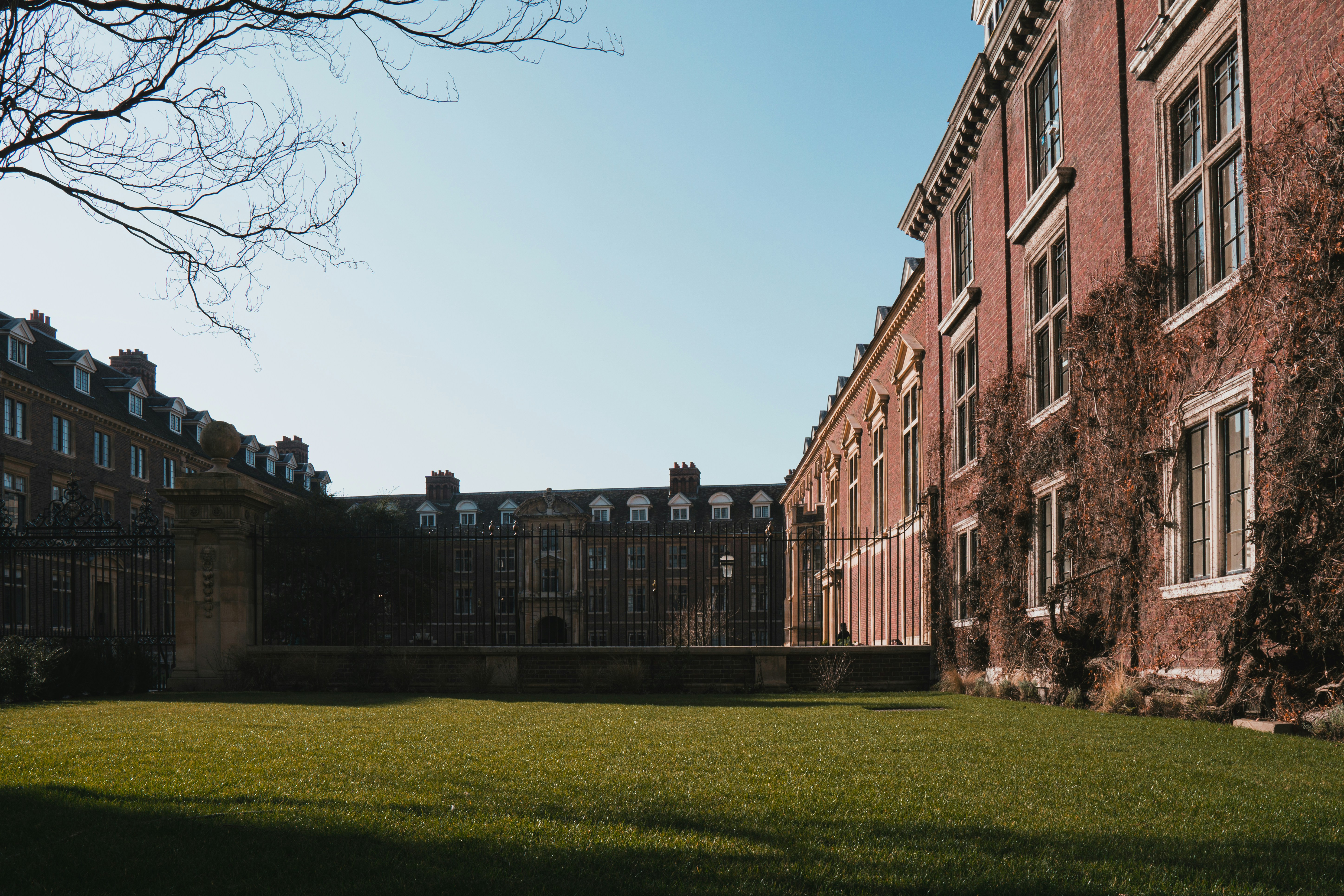 a large building with a lawn in front of it