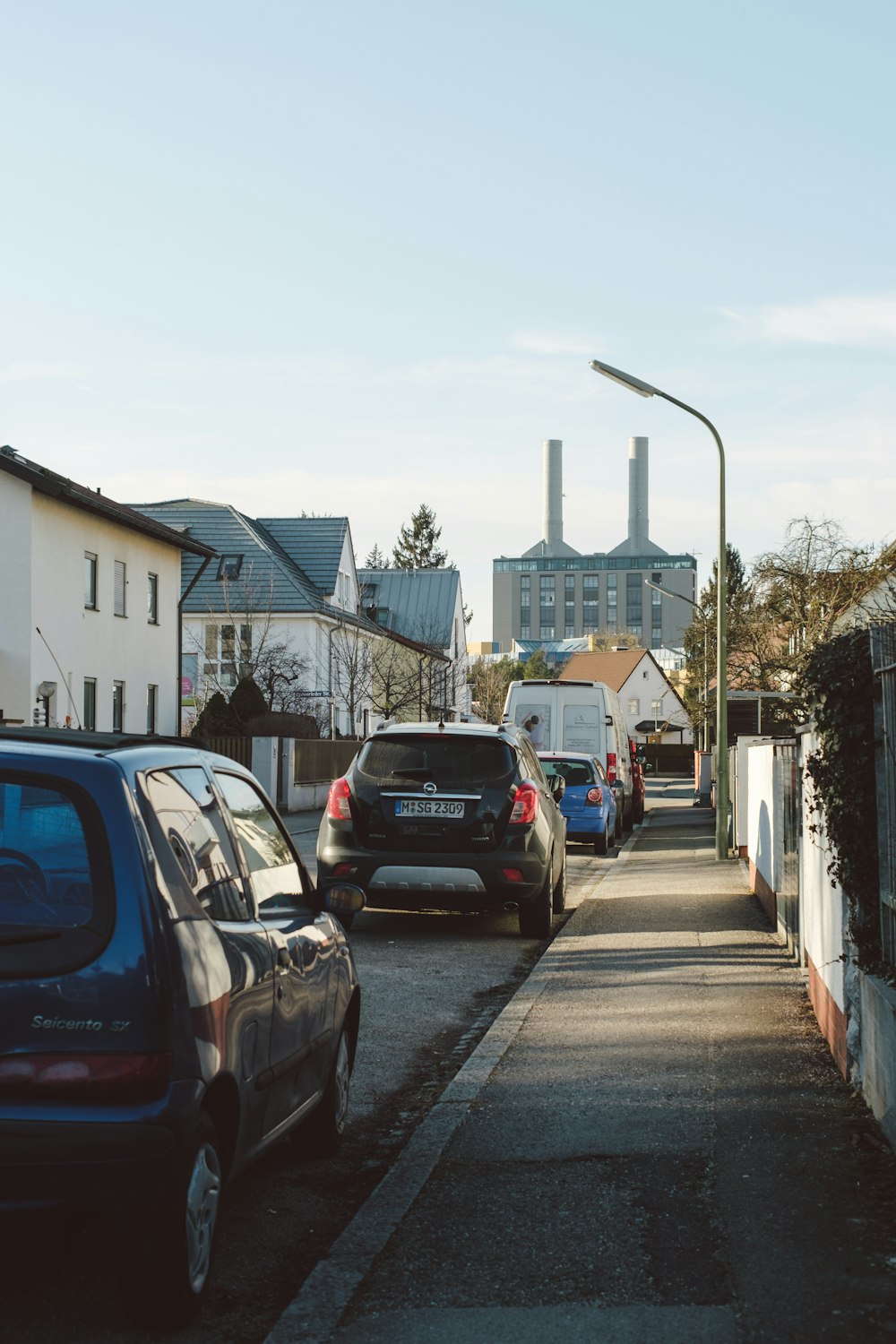 cars are parked on the side of the road