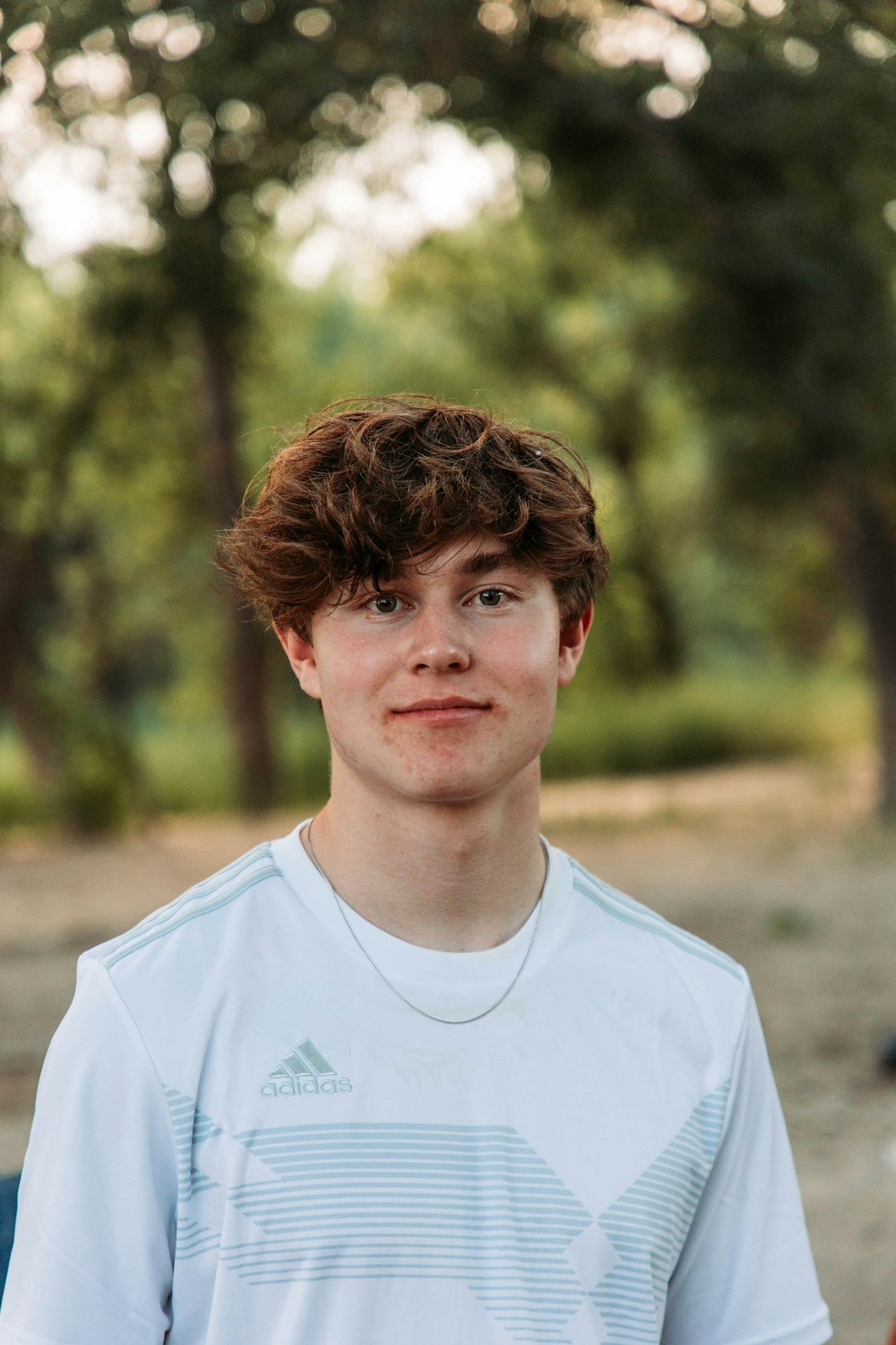 a young man is posing for a picture