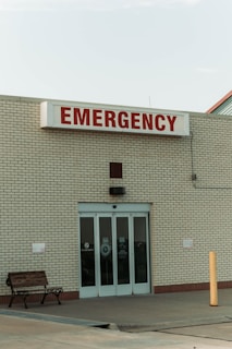 a brick building with a bench in front of it