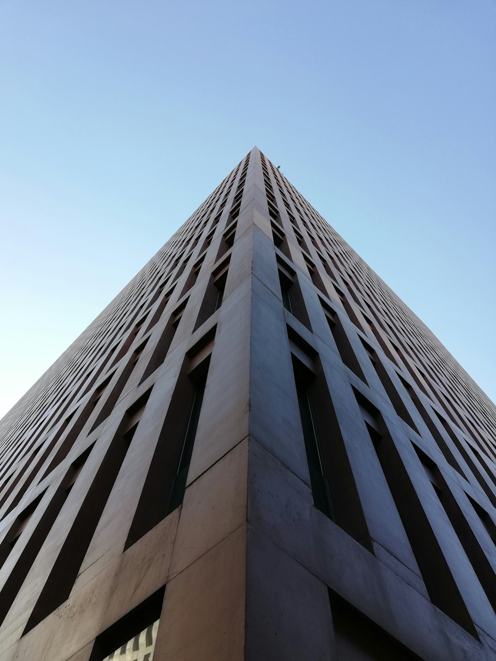 a tall building with a sky background