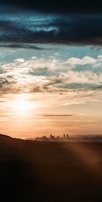 A scenic view of a city skyline at sunset.