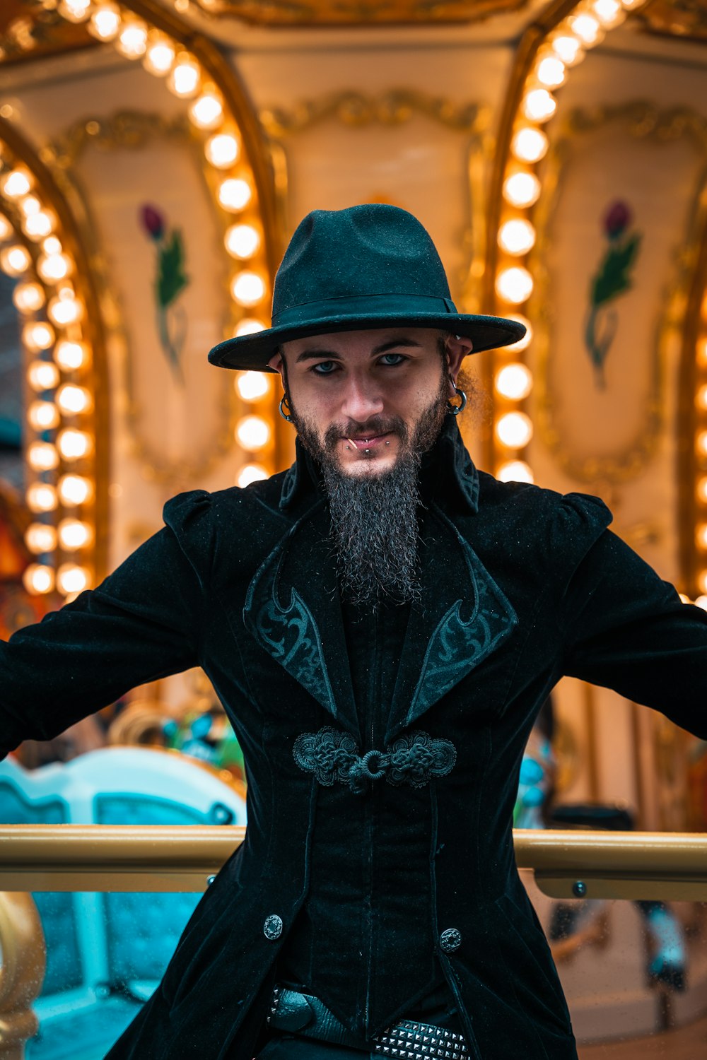 a man with a beard wearing a green hat