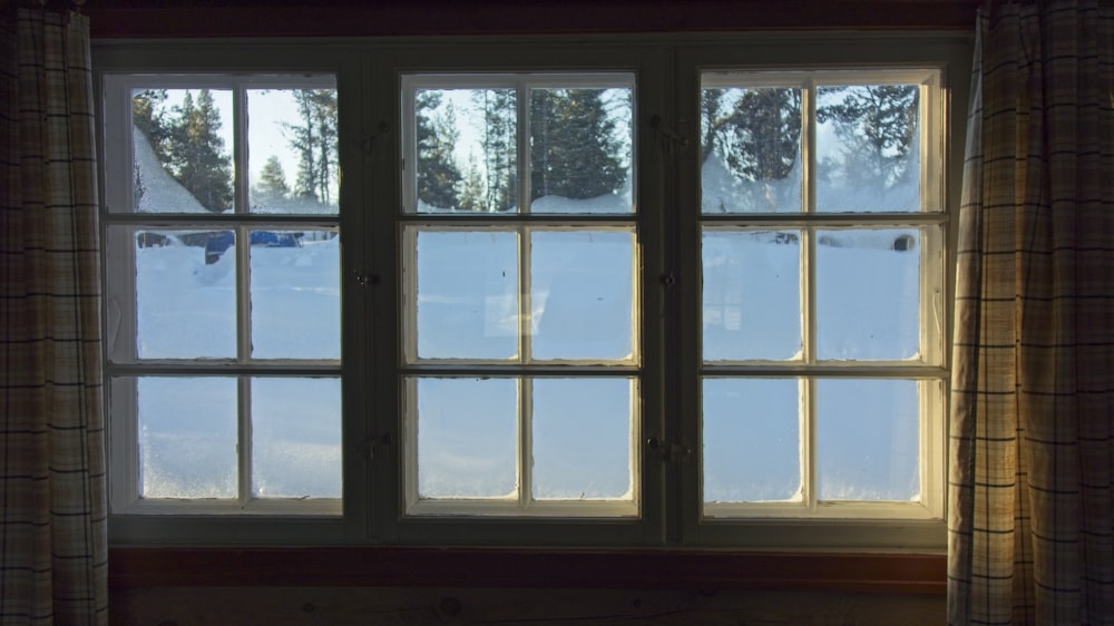 a window with a view of the snow outside