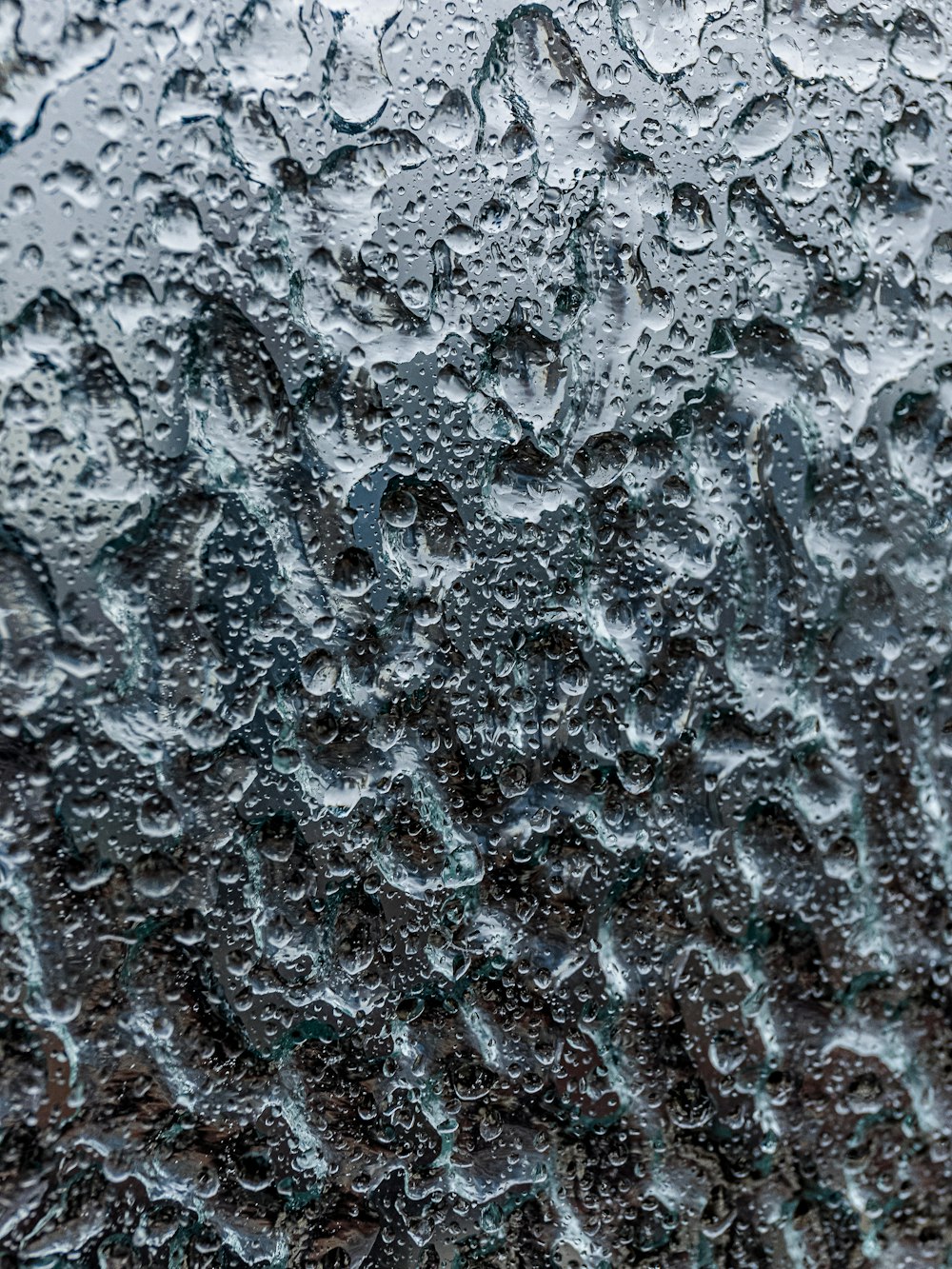 a close up of water droplets on a window