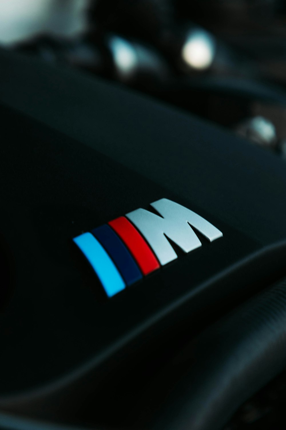 a close up of a bmw logo on a car