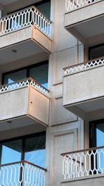 Apartment balcony glass with privacy-enhancing polarized film.