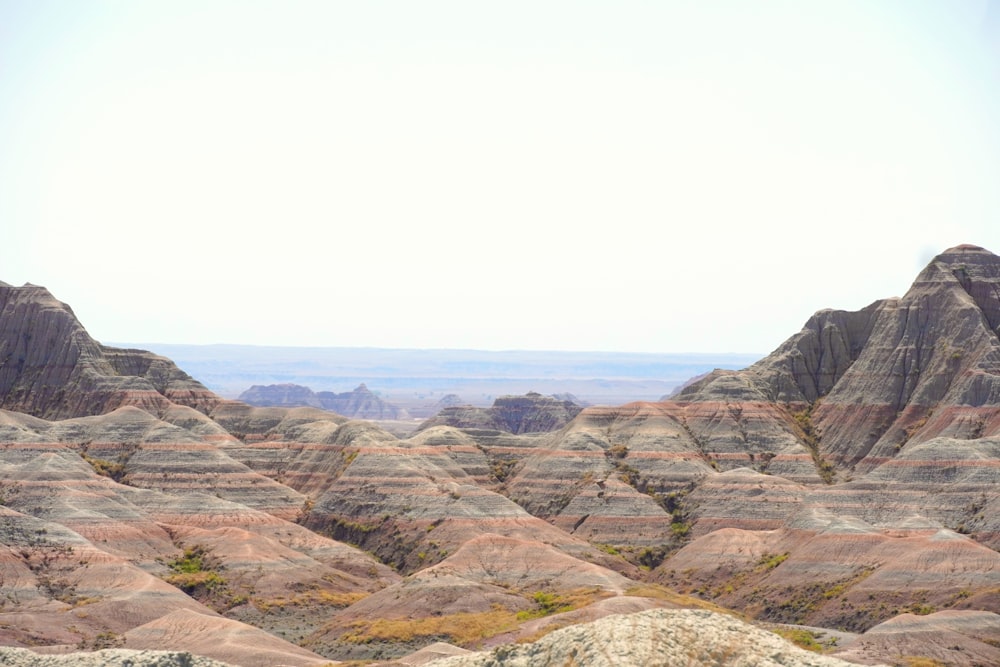 a view of the mountains from the top of a hill