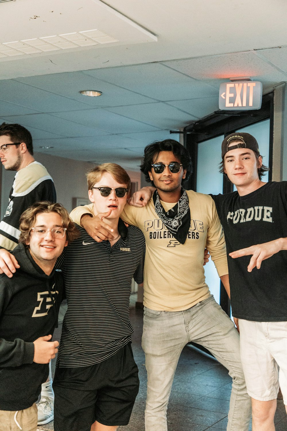 a group of young men standing next to each other