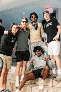 a group of young men standing next to each other