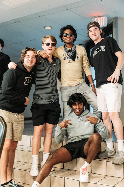 a group of young men standing next to each other